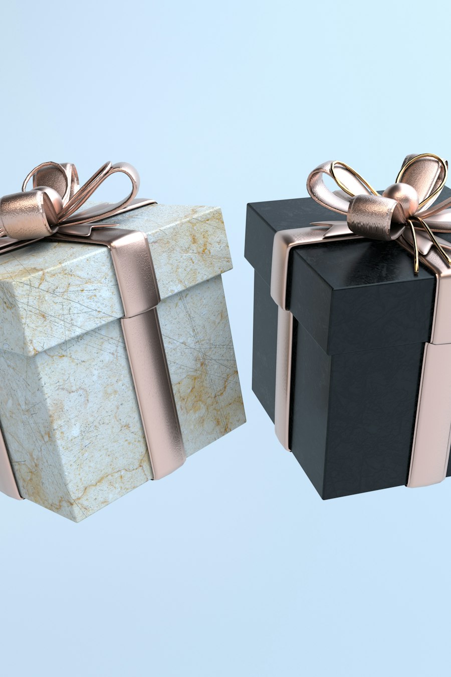 Duas caixas de presente com laço dourado